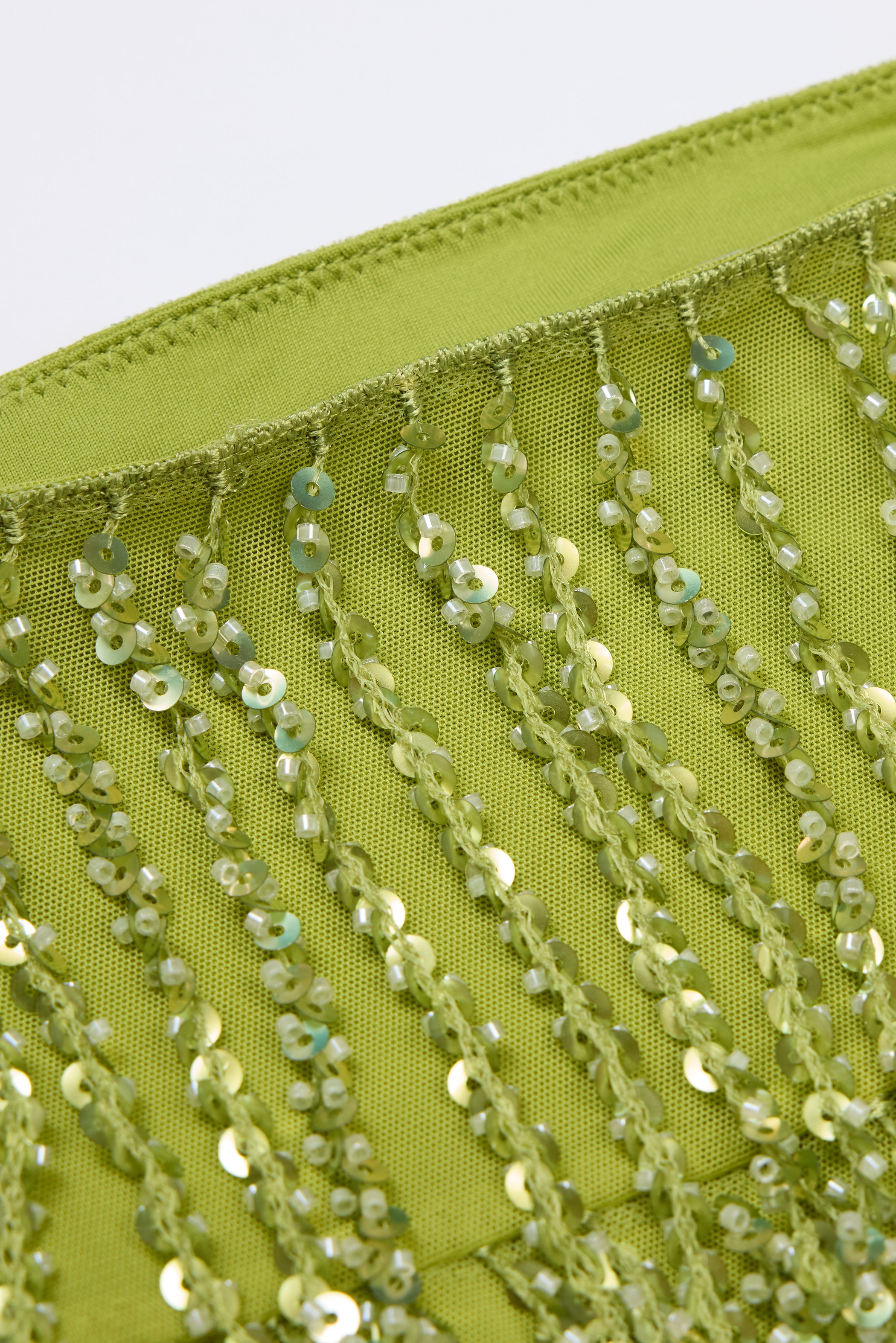 Fringed Low-Rise Mini Skirt in Olive