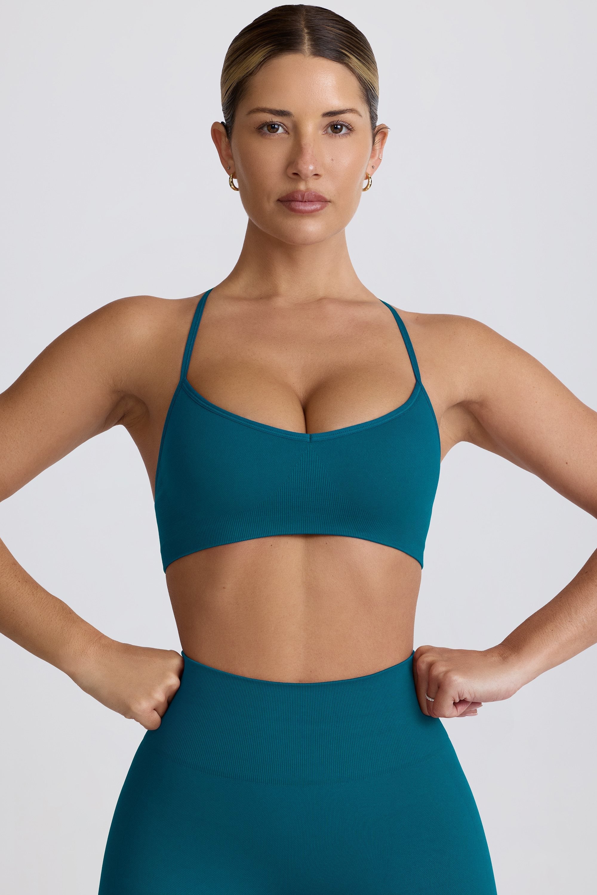 Super Sculpt Seamless Cross-Back Sports Bra in Teal - 1